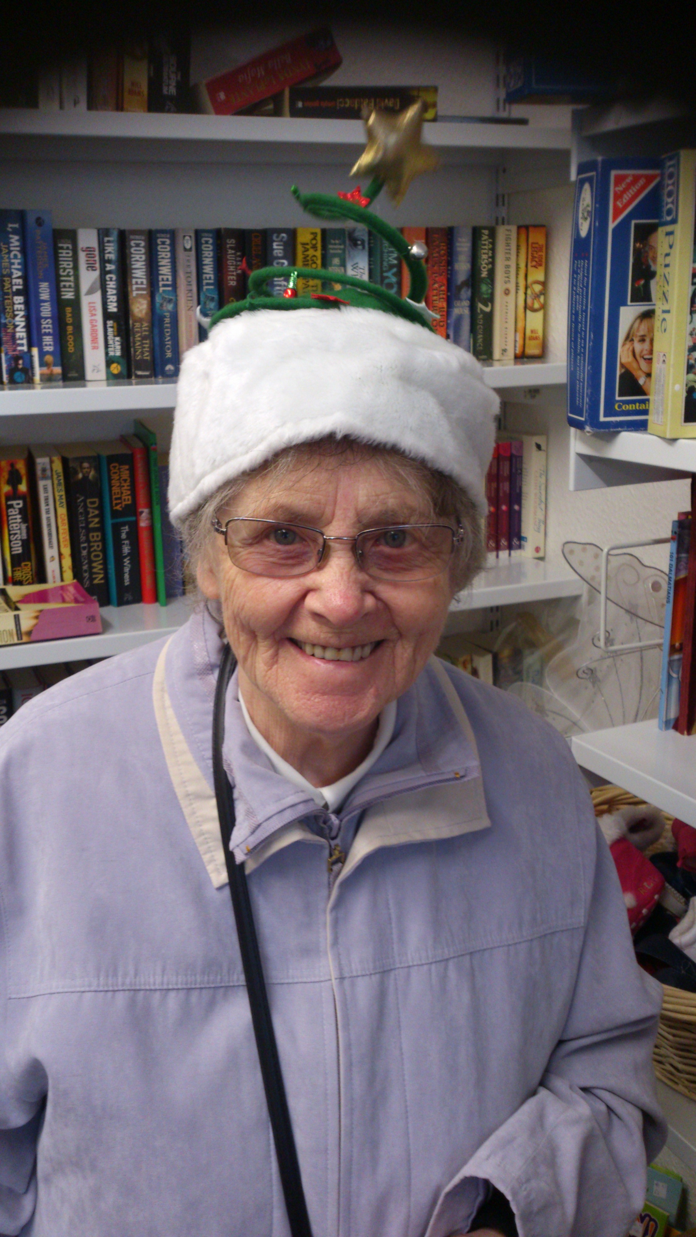 Nana smiling in a Christmas hat